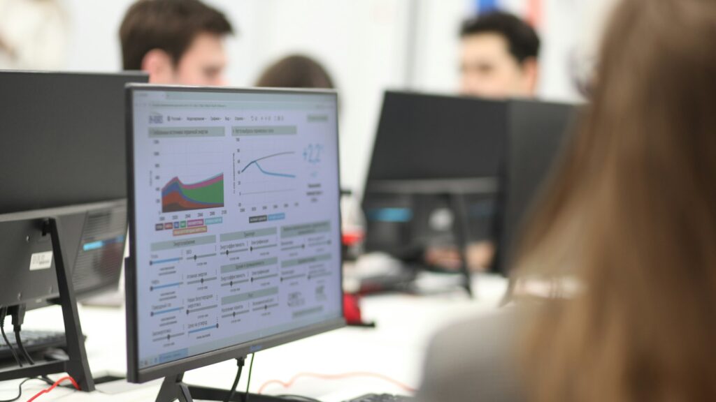 Finance team reviewing operations dashboards in an office